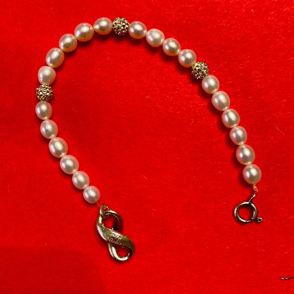 Tiffany bracelet in real pearls and three of them are with sparkles, like new